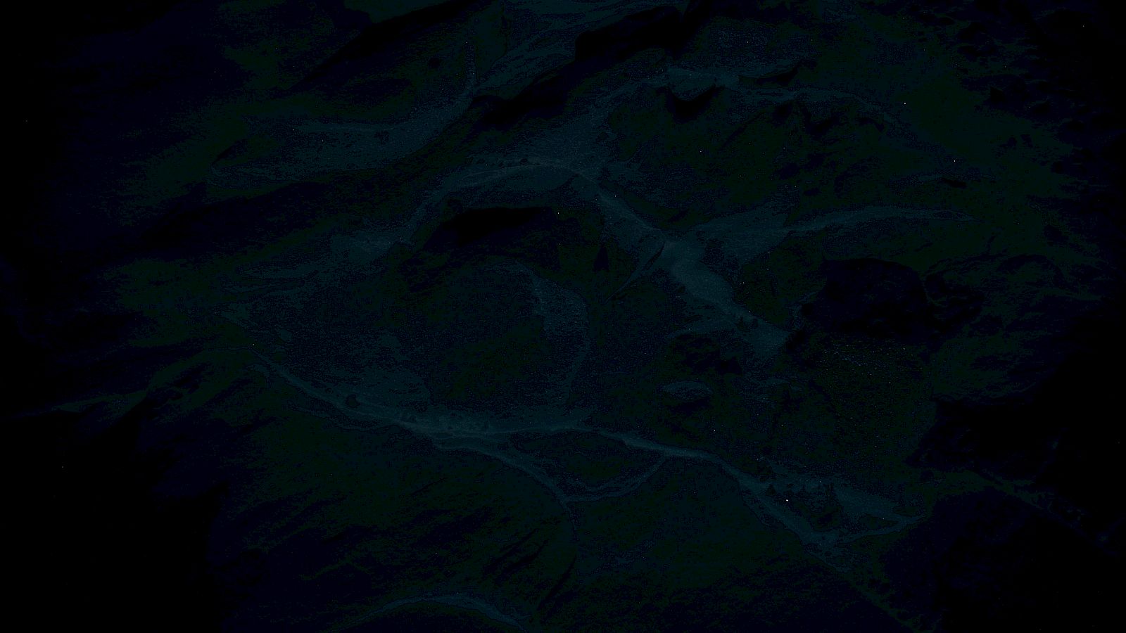 The image is very dark and unclear, possibly depicting a low-light or abstract scene with minimal visible details.